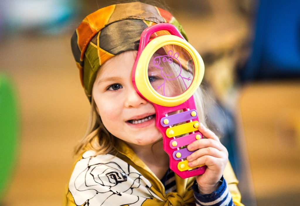 Girl discovering at playgroup in Mousehole 